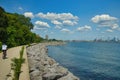 A cyclist rides along a Lake Michigan shoreline recreational trail in Milwaukee.