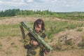 Girl in uniform with a Bazooka