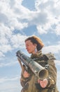 Girl in uniform with a Bazooka