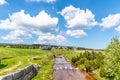 Sunny summer day in Jizerka mountain village. Jizerka river, green meadows and blue sky with white clouds, Jizera Royalty Free Stock Photo