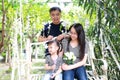 Happy family parental activity mother father daughter hand in hand play and have fun outdoor in summer park child parent love girl Royalty Free Stock Photo