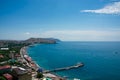 Sunny summer day. View of city from above. Black sea and mountains. Sudak, Crimea Royalty Free Stock Photo