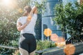 Sunny summer day. Young woman doing stretching exercises outdoor. Girl doing warm-up on steps before training. Royalty Free Stock Photo