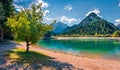 Sunny summer dayon Jasna lake. Stunning summer scene of Julian Alps, Gozd Martuljek location, Slovenia, Europe. Bright landscape o