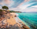 Sunny summer seascape of Aegean Sea. Beautiful sunrise on Cuba Beach, Olimpiada village location, Greece, Europe. Beauty of nature Royalty Free Stock Photo