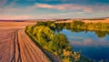 Sunny summer sunset on outskirts of Ternopil town with small pond. Royalty Free Stock Photo