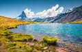 Sunny summer view of Stellisee lake. Breathtaking outdoor scene with Matterhorn Royalty Free Stock Photo