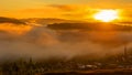 Sunny sunrise over the Ural mountains over the village of Inzer Royalty Free Stock Photo