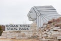 Sunny view of the entrance sign of Roman Nose State Park