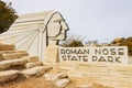 Sunny view of the entrance sign of Roman Nose State Park