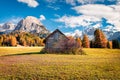 Sunny view of Rocca dei Baranci mountain from Vallone village. Colorful autumn scene in the Dolomite Alps, Province of Bolzano -