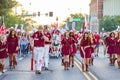 Sunny view of the student Marching Band walking in Homecoming parade Royalty Free Stock Photo