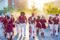 Sunny view of the student Marching Band walking in Homecoming parade Royalty Free Stock Photo
