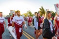 Sunny view of the student Marching Band walking in Homecoming parade Royalty Free Stock Photo