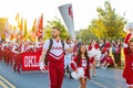 Sunny view of the student Marching Band walking in Homecoming parade Royalty Free Stock Photo