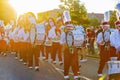 Sunny view of the student Marching Band walking in Homecoming parade Royalty Free Stock Photo