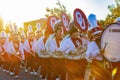 Sunny view of the student Marching Band walking in Homecoming parade Royalty Free Stock Photo