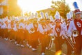 Sunny view of the student Marching Band walking in Homecoming parade Royalty Free Stock Photo