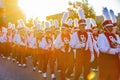 Sunny view of the student Marching Band walking in Homecoming parade Royalty Free Stock Photo