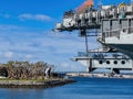 Sunny view of the USS Midway Museum and The Kissing Statue Royalty Free Stock Photo