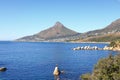 A sunny view from Victoria road, over the blue sea towards Lion\'s Head. Royalty Free Stock Photo