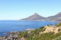 A sunny view from Victoria road, over the blue sea towards Lion\'s Head. Royalty Free Stock Photo