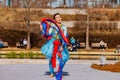 Sunny view of a woman dancer doing Chinese style dance