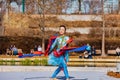 Sunny view of a woman dancer doing Chinese style dance