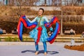 Sunny view of a woman dancer doing Chinese style dance