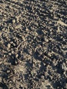 Background of a plowed field with clods of soil wet after rain, close-up, natural texture without a horizon line, in Germany Royalty Free Stock Photo