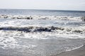 The sunny white clear water waves at the Atlantic Ocean Royalty Free Stock Photo