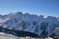 Sunny winter day in alpine ski resort. Royalty Free Stock Photo