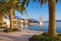 Sunny winter day in Mediterranean town. View of the embankment of Tivat city, Montenegro Royalty Free Stock Photo