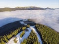 On A Sunny Winter Day Over The Clouds In The Carpathian Mountains, Mist In The Valley