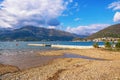 Sunny winter Mediterranean landscape - sky, sea and deserted beach. Montenegro, Kotor Bay
