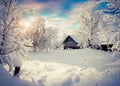 Sunny winter morning in the mountain village after heavy snowfall. Royalty Free Stock Photo