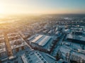 sunny winter over arctic town, sunset and snow at european city suburb residential district, snowfall at europe aerial