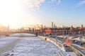 Sunny winter panoramic shot of the Moscow Kremlin, the Bolshoy Moskvoretsky Bridge and the partially frozen Moskva River