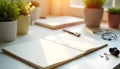 Sunny Workspace: Open Notebook, Pen, Plants, and Earbuds Royalty Free Stock Photo