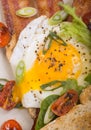 Sunnyside up egg on bacon and toast Royalty Free Stock Photo