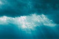 Sunrays Through Blue Rainy Dramatic Sky. Natural Abstract Background Royalty Free Stock Photo