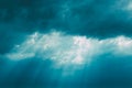 Sunrays Through Blue Rainy Dramatic Sky. Natural Abstract Background Royalty Free Stock Photo
