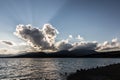 Sunrays through dark clouds above Montedoglio lake Tuscany, Italy Royalty Free Stock Photo