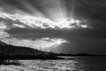 Sunrays through dark clouds above Trasimeno lake Umbria, Italy Royalty Free Stock Photo