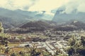 Sunrays leaking from clouds over peaceful village in Bumthang valley, Bhutan. Royalty Free Stock Photo