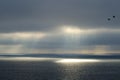 Beautiful sunrise ocean landscape. Sun spots on the sea surface. Royalty Free Stock Photo