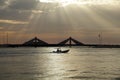 Sunrays and the speeding boat near Sheikh Salman Causeway bridge Bahrain