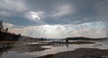 Sunrays and sunbeams above steam rising off Hot Lake in the Lower Geyser Basin in Yellowstone National Park in Wyoming USA Royalty Free Stock Photo