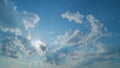Sunrays sunray shine through dark clouds in cloudy blue sky. Layers of cloud space. Natural background. Time lapse. Royalty Free Stock Photo