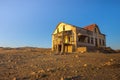 Sunrise above an abandoned house in Kolmanskop ghost town, Namibia Royalty Free Stock Photo